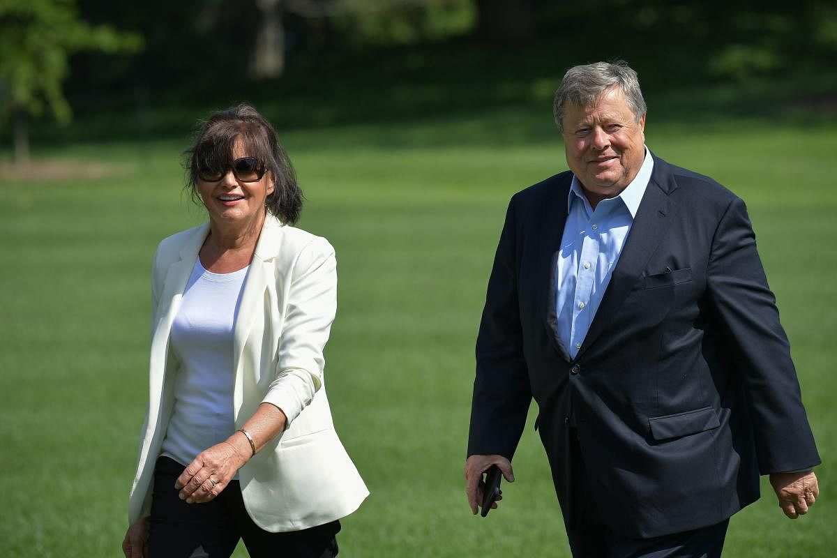 Viktor and Amalija Knavs, the parents of US First Lady Melania Trump, walk across the South Lawn upon return to the White House in Washington, DC, on June 18, 2017. AFP