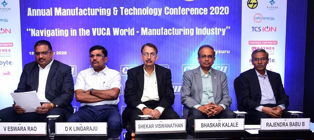 Annual Manufacturing and Technology Conference 2020 chairperson V Eswara Rao, Department of Industries and Commerce (DIC) Joint Director D K Lingaraju, vice-chairman and whole-time director of Toyota Kirloskar Motor Shekar Viswanathan and Confederation of Indian Industry (CII) chairman Bhaskar Kalale during the conference, in Mysuru on Tuesday. DH photo