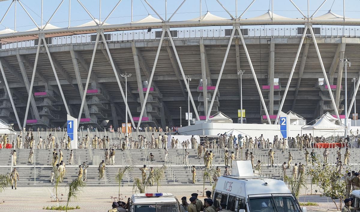 Police personnel keep vigil at Sardar Patel Stadium, commonly known as Motera Stadium, which will host 'Namaste Trump' event during US President Donald Trump's maiden visit to India, in Ahmedabad, Saturday, Feb. 22, 2020. (PTI Photo)