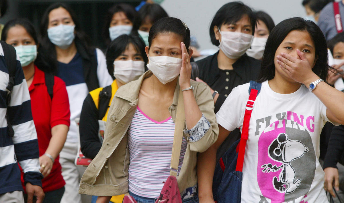 Foreign domestic workers wear masks to protect themselves from Severe Acute Respiratory Syndrome (SARS), in Hong Kong