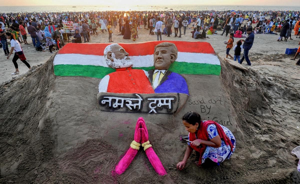  Sand artist Laxmi Gaud creates a sculpture of Prime Minister Narendra Modi and US President Donald Trump on the eve of latter's maiden visit to India, at Juhu Beach in Mumbai, Sunday, Feb. 23, 2020. (PTI Photo)