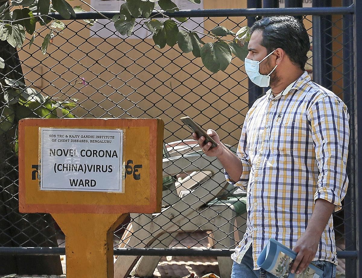 A man, who recently travelled from China, waits to get checked for the coronavirus at Rajiv Gandhi Institute of Chest Diseases, in Bengaluru, Friday, Jan. 31, 2020. (PTI Photo)