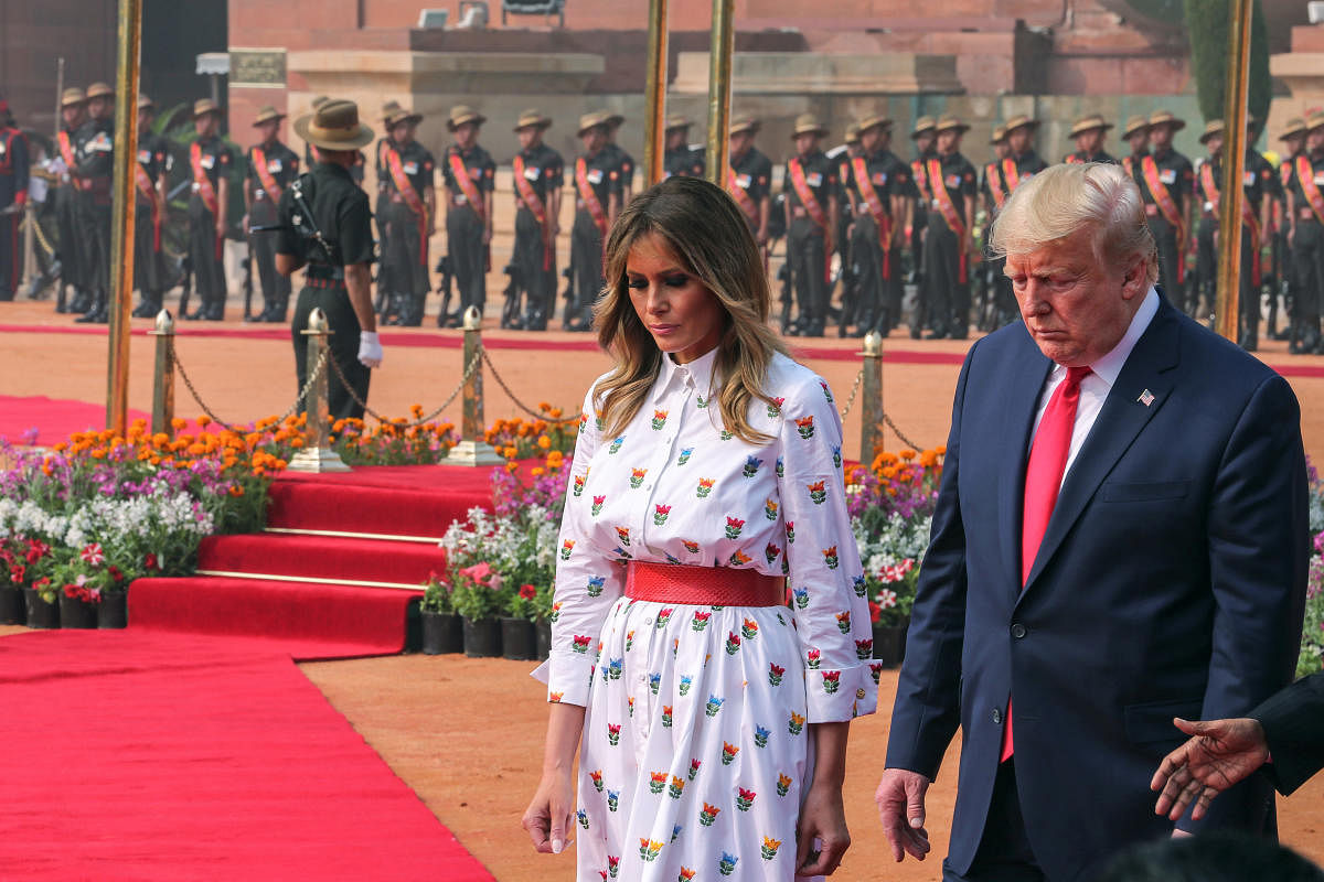 US President Donald Trump and his wife and first lady Melania Trump walk during Trump's ceremonial reception at the forecourt of India's Rashtrapati Bhavan Presidential Palace in New Delhi. Reuters
