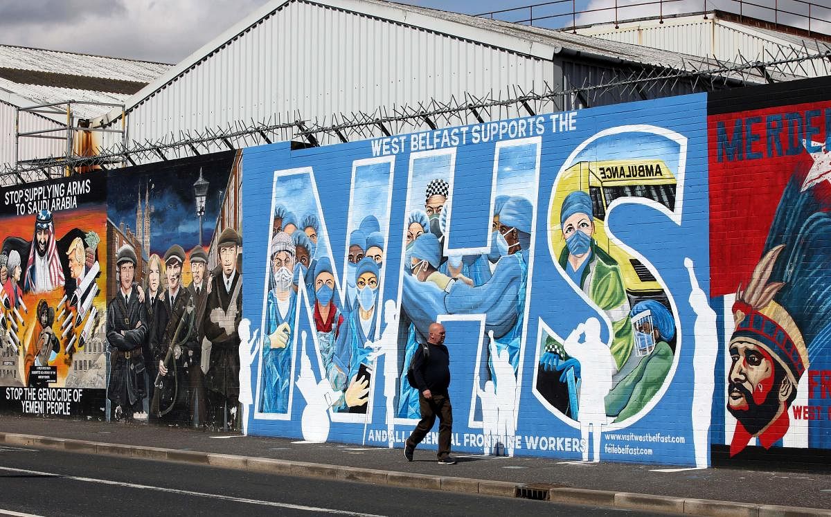 A street art graffiti mural in support of the NHS (National Health Service) is pictured on the Nationalist Falls road in east Belfast on May 5, 2020. Credit: AFP Photo