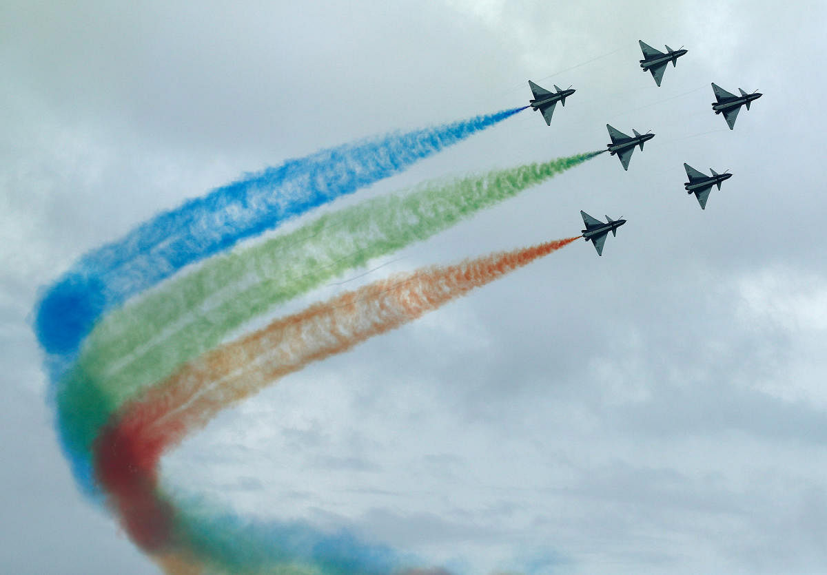 China's People's Liberation Army Air Force (PLAAF) Ba Yi aerobatics team perform an aerial display during a media preview of the Singapore Airshow in Singapore. Credit: Reuters Photo