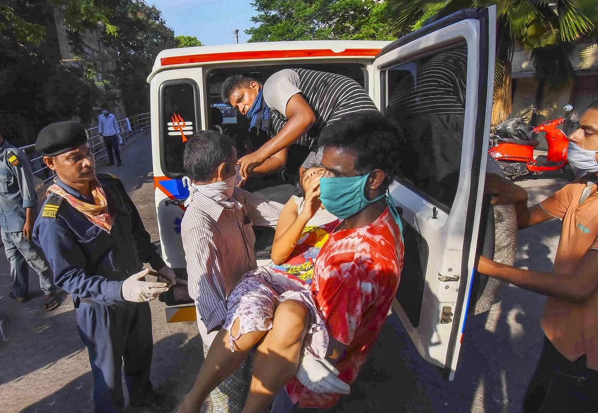 An unconscious woman affected by styrene vapour leak from a polymer plant, being carried to a hospital for treatment, in Visakhapatnam, Thursday, May 7, 2020. Credit: PTI Photo