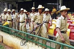 Policemen guarding the Chinnaswamy Stadium in Bangalore on Thursday ahead of the second cricket Test match between India and Australia. DH PHOTO