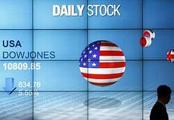 a screen showing the falling Dow Jones industrials at Mirae Asset building in Seoul. AP Photo