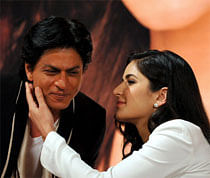 Indian Bollywood actor Shah Rukh Khan (L) is embraced by actress Katrina Kaif during a promotional event for the forthcoming Hindi filmJab Tak Hai Jaan in Mumbai late October 29, 2012. The film was directed by Bollywood legend Yash Chopra who died on October 21. AFP PHOTO