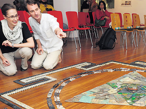 Waste meets art Swiss artist Raphael Perret explains an artwork made from recycled e-waste at his art exhibition,  Recycling Yantra, in Bangalore on Wednesday. DH photo