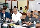 Chief Minister B S Yeddyurappa sharing a word with Southern Command Major General K N Mirji, K and K Sub Area Commander Brigadier P S Ravindranath and other officials at Civil Military Liaison conference at Vidhana Soudha on Wednesday. Chief Secretary S V Ranganath is also seen. DH Photo