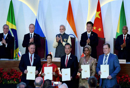 Prime Minister Narendra Modi with Brazilian President Michel Temer, Russian President Vladimir Putin, Chinese President Xi Jinping and South African President Jacob Zuma witness exchange of agreements during BRICS Summit in Benaulim, Goa on Sunday. PTI Photo
