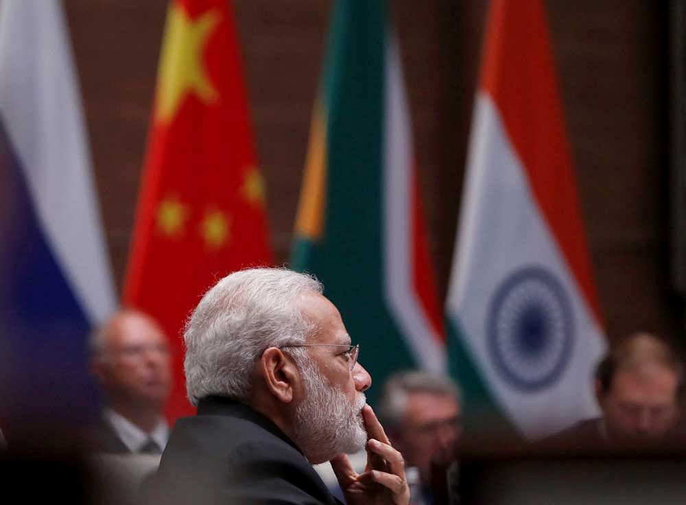 Indian Prime Minister Narendra Modi attends a plenary session of BRICS Summit, in Xiamen, China, Monday, Sept. 4, 2017. Five major emerging economies opened a summit Monday to map out their future course, with host Chinese President Xi Jinping calling on them to play a bigger role in world governance, reject protectionism and inject new energy into tackling the gap between the world's wealthy and developing nations. AP/PTI