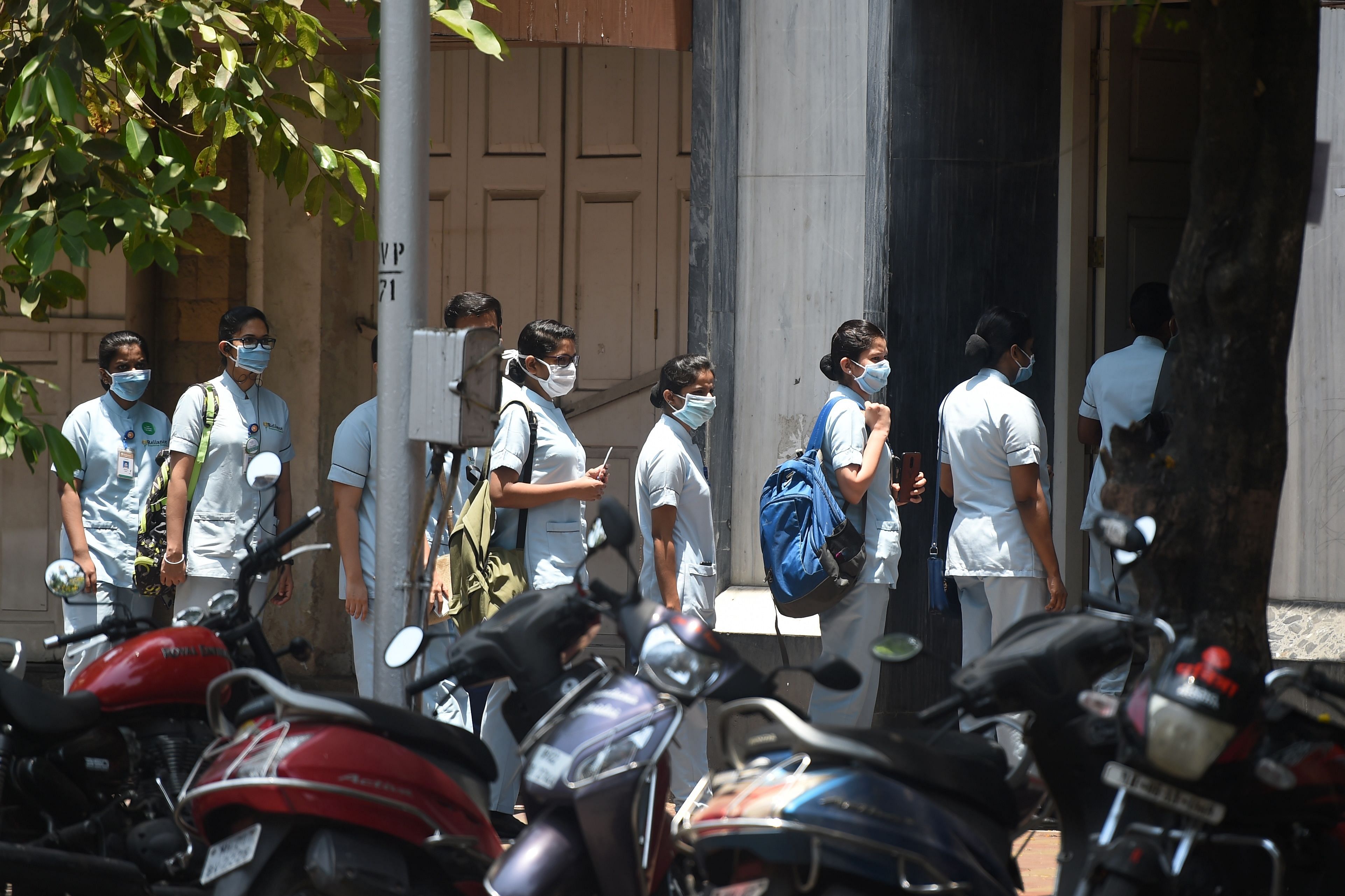 Nurses wearing masks queue up to enter the HN Reliance Foundation hospital. (Credti: AFP Photo)