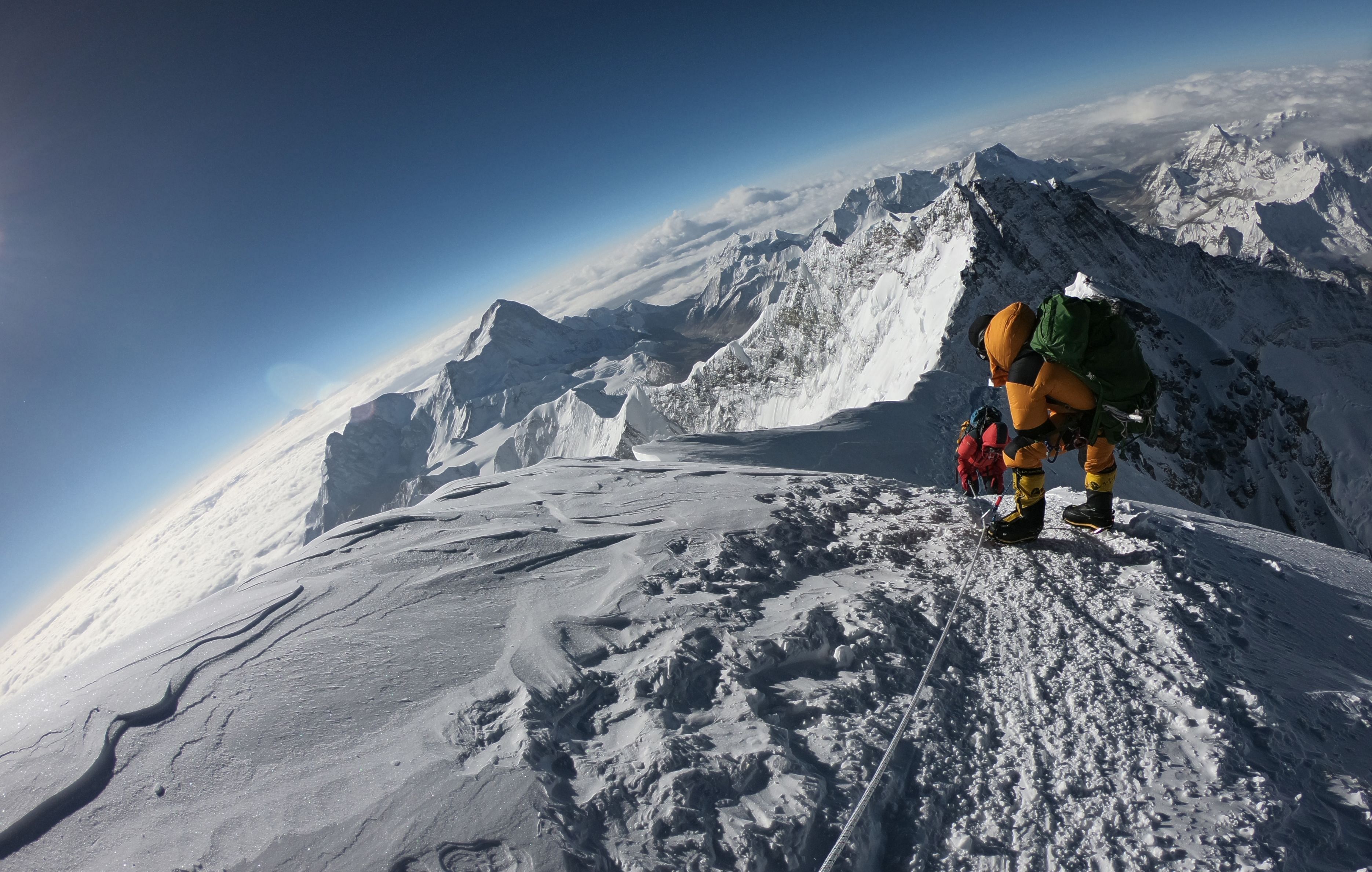 Mountaineers make their way to the summit of Mount Everest, as they ascend on the south face from Nepal. (AFP Photo)