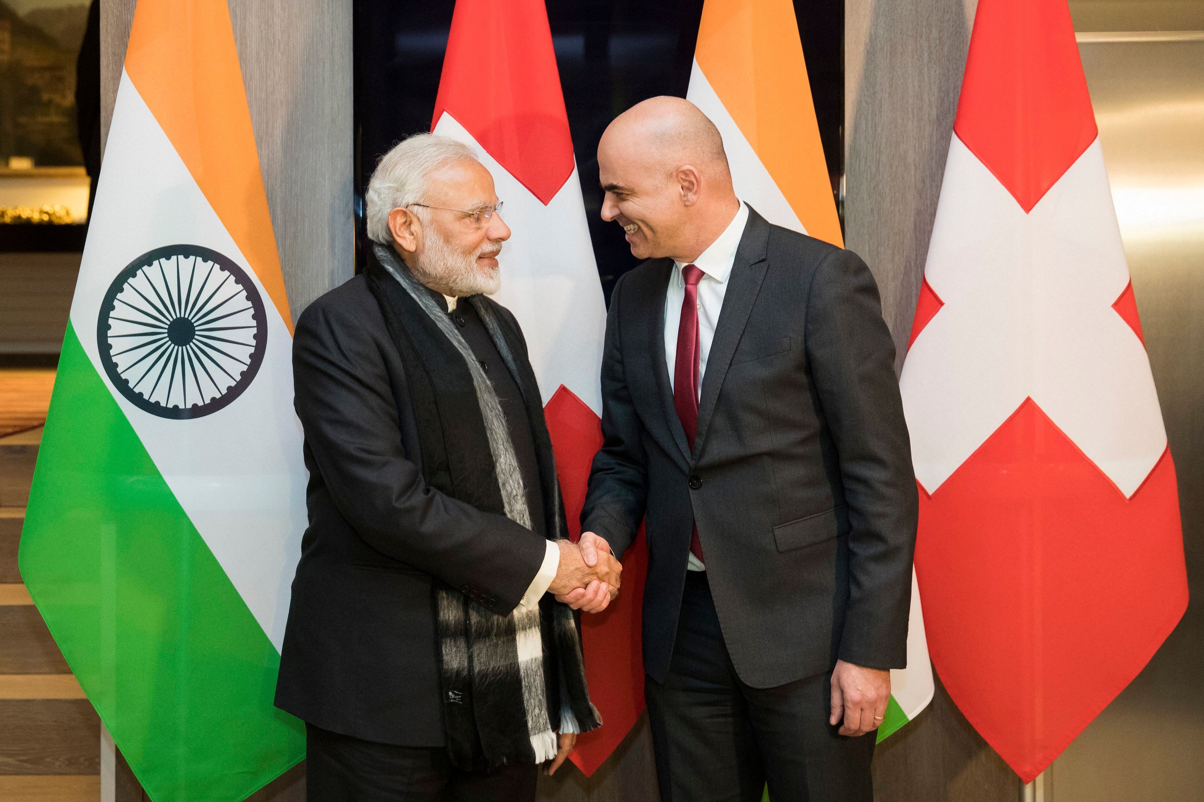 Swiss Federal President Alain Berset, right, and Indian Prime Minister Narendra Modi, shake hands prior to a meeting one day before the start of the 48th annual meeting of the World Economic Forum, WEF, in Davos, Switzerland. (AP Photo)