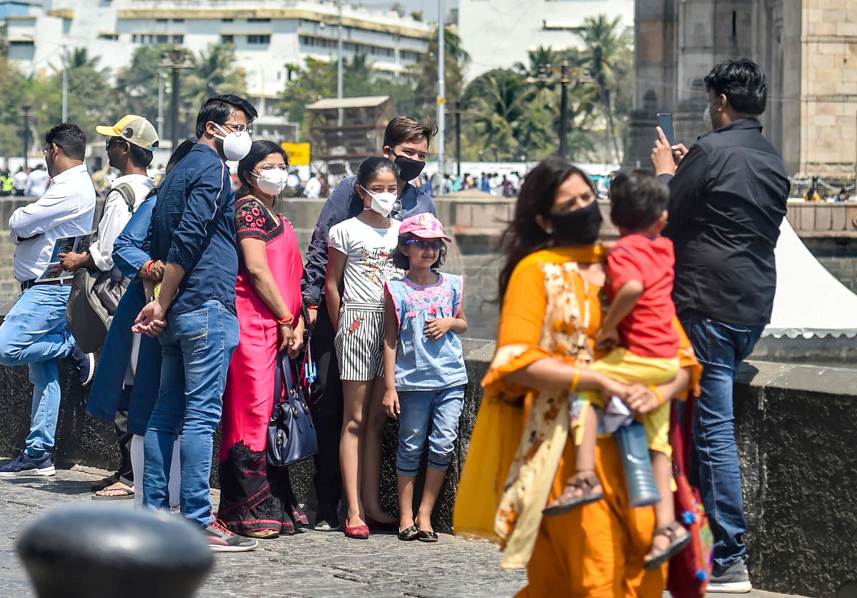  Tourists wear protective masks in view of coronavirus pandemic (PTI Photo)