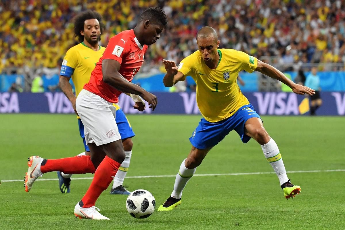 Switzerland's forward Breel Embolo and Brazil's defender Miranda compete for the ball during the Russia 2018 World Cup Group E football match. AFP PHOTO
