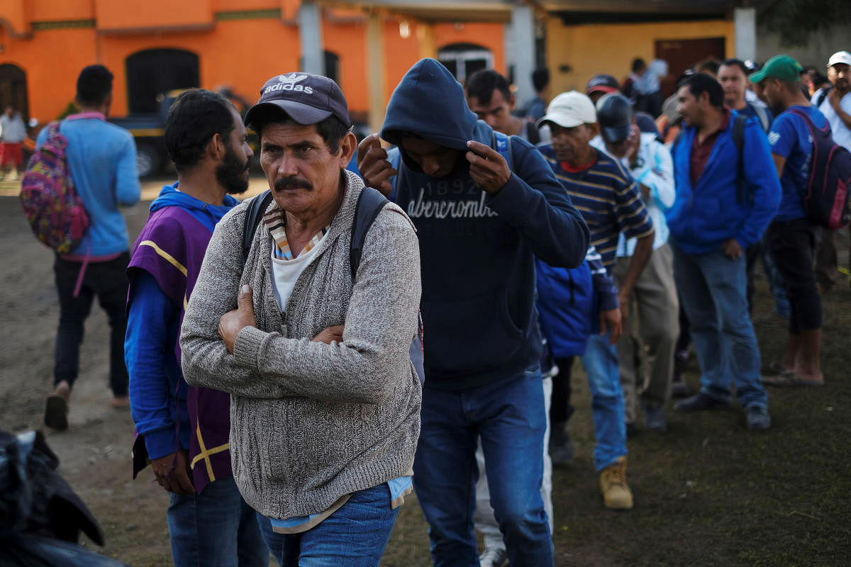 Migrants travelling to the U.S. make a line to get breakfast in an improvised shelter in Tecun Uman, Guatemala, January 22, 2020. (Reuters Photo)