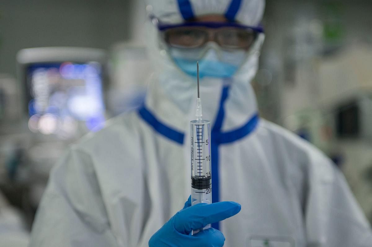 This photo taken on February 22, 2020 shows a nurse preparing equipment in an intensive care unit treating COVID-19 coronavirus patients at a hospital in Wuhan, in China's central Hubei province. (AFP Photo)