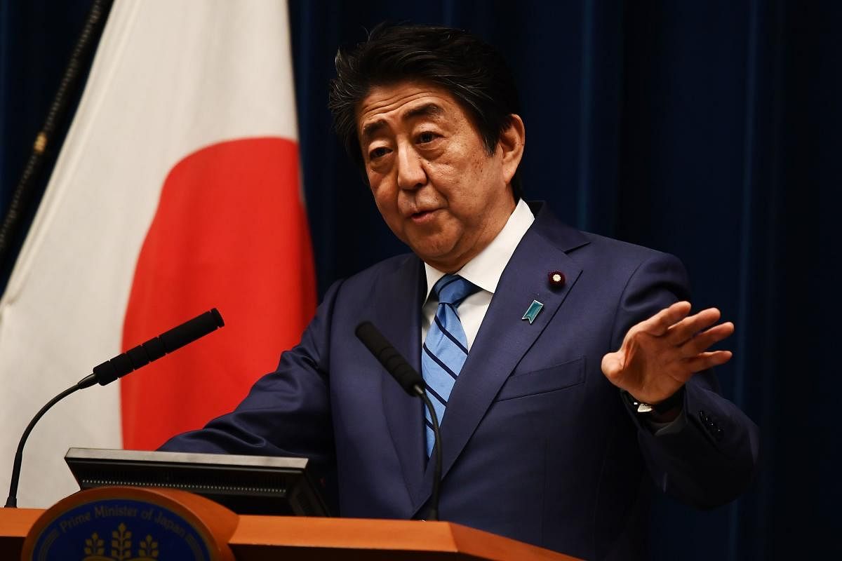 Japanese Prime Minister Shinzo Abe talks to the media during a press conference in Tokyo on March 14, 2020. (AFP Photo)