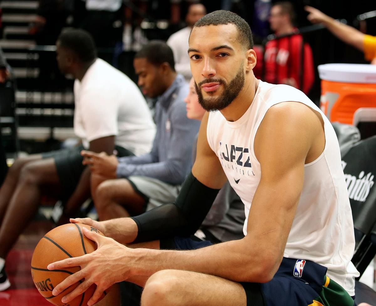 In this file photo taken on December 04, 2019 Utah Jazz center Rudy Gobert cools down after warm ups before a NBA game against Los Angeles Lakers in Salt Lake City, Utah. - Utah Jazz star Rudy Gobert, who apologized for his careless actions before he was