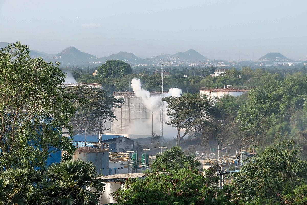 Smokes rise from an LG Polymers plant following a gas leak incident in Visakhapatnam on May 7, 2020. - Eleven people were killed and hundreds hospitalised after a pre-dawn gas leak at a chemical plant in eastern India on May 7 that left unconscious victim