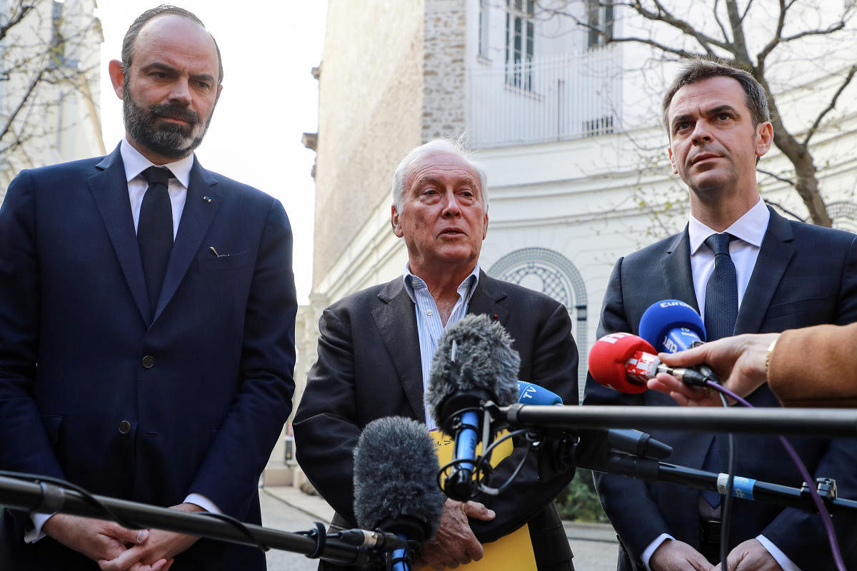 French Health and Solidarity Minister Veran, French Prime Minister Philippe and immunologist Delfraissy address the media in the courtyard of the French Interior Ministry in Paris. Credit: Reuters Photo