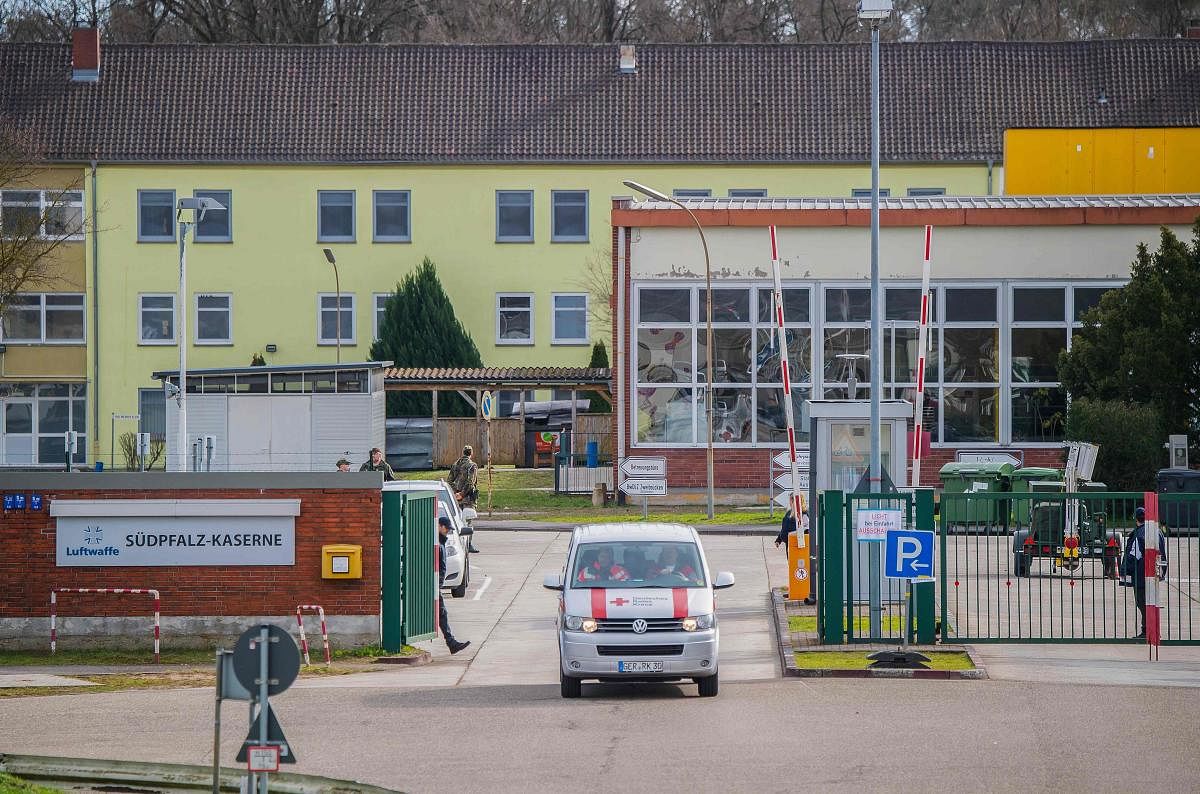 Medical personnel leave the air force base in Germersheim, near Stuttgart in southwestern Germany, on February 16, 2020, where German citizens evacuated from the Chinese city of Wuhan, epicentre of the coronavirus outbreak, were held in quarantine. Credit: AFP Photo