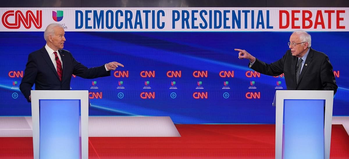 Democratic presidential hopefuls former US vice president Joe Biden (L) and Senator Bernie Sanders. (AFP Photo)
