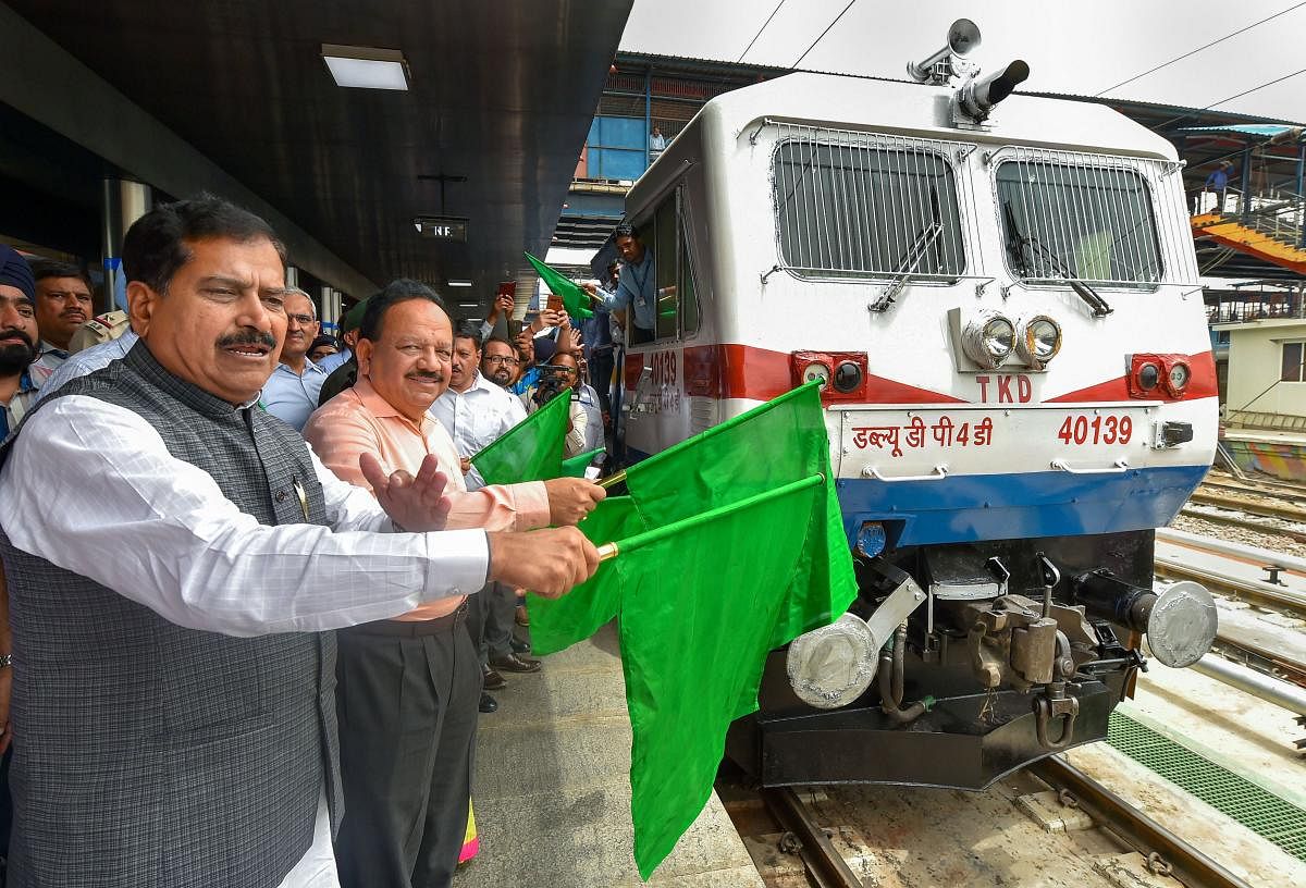 Union Health Minister Harsh Vardhan and Minister of State (MoS) for Railways Suresh Angadi flag off vinyl wrapped train coaches during a function by Northern Railway to commemorate 20th Kargil Vijay Diwas, at New Delhi Railway Station, Monday, July 15, 2019. (PTI Photo)