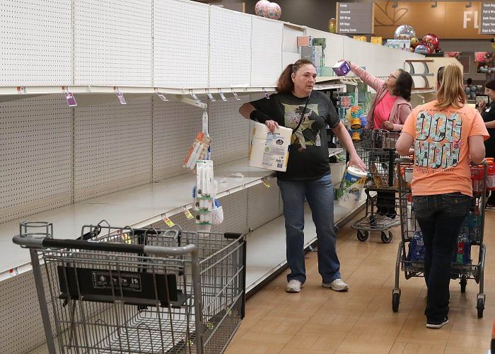 Shelves normally stocked with toilet paper and paper towels sit empty at a Giant Supermarket store as people stockpile supplies due to the outbreak of the coronavirus (COVID-19). Credit: AFP Photo