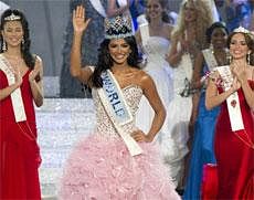 Miss Venezuela, Ivian Sarcos, center, surrounded by Miss Philippines, Gwendoline Ruais, left and Miss Puerto Rico, Amanda Perez, right, reacts after being crowned Miss World 2011 at a central London venue, Sunday. AP