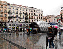 Downpour Streets of Madrid are dotted with colourful umbrellas as rain lashes the city. Photo by author