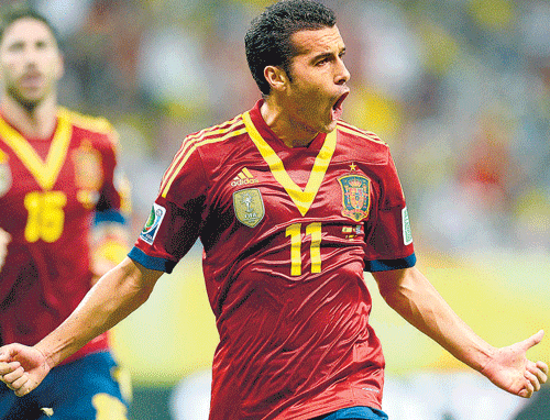 red hot Spain's Pedro celebrates after scoring against Uruguay in their Confederations Cup match. REUTERS
