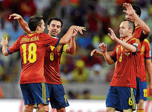 Shining brightly: Spain's Jordi Alba (left) is congratulated by his team-mates after scoring against Nigeria during their Confederations Cup match on Sunday. afp