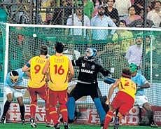 Pau Quemada (second from right) scores Spains final goal during their 5-2 drubbing of India in the World Cup in New Delhi on Thursday. PTI