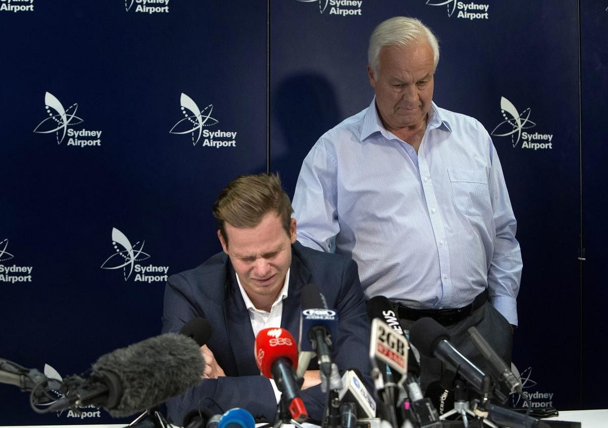 Former Australian cricket captain Steve Smith, speaks to the media while being supported by his father, Peter, in Sydney after being sent home from South Africa following a ball-tampering scandal. AP/PTI photo