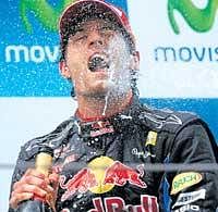 JUBILANT:  Red Bulls Mark Webber celebrates after winning the Spanish Grand Prix.  AP