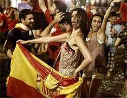 Spanish fans celebrate in a fountain in downtown Madrid after Spain defeated the Netherlands to win the World Cup soccer final. AP Photo