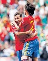 Spain's David Silva (centre) celebrates with   team-mate Santiago Cazorla after scoring against Mexico during their international friendly match on Wednesday. AP
