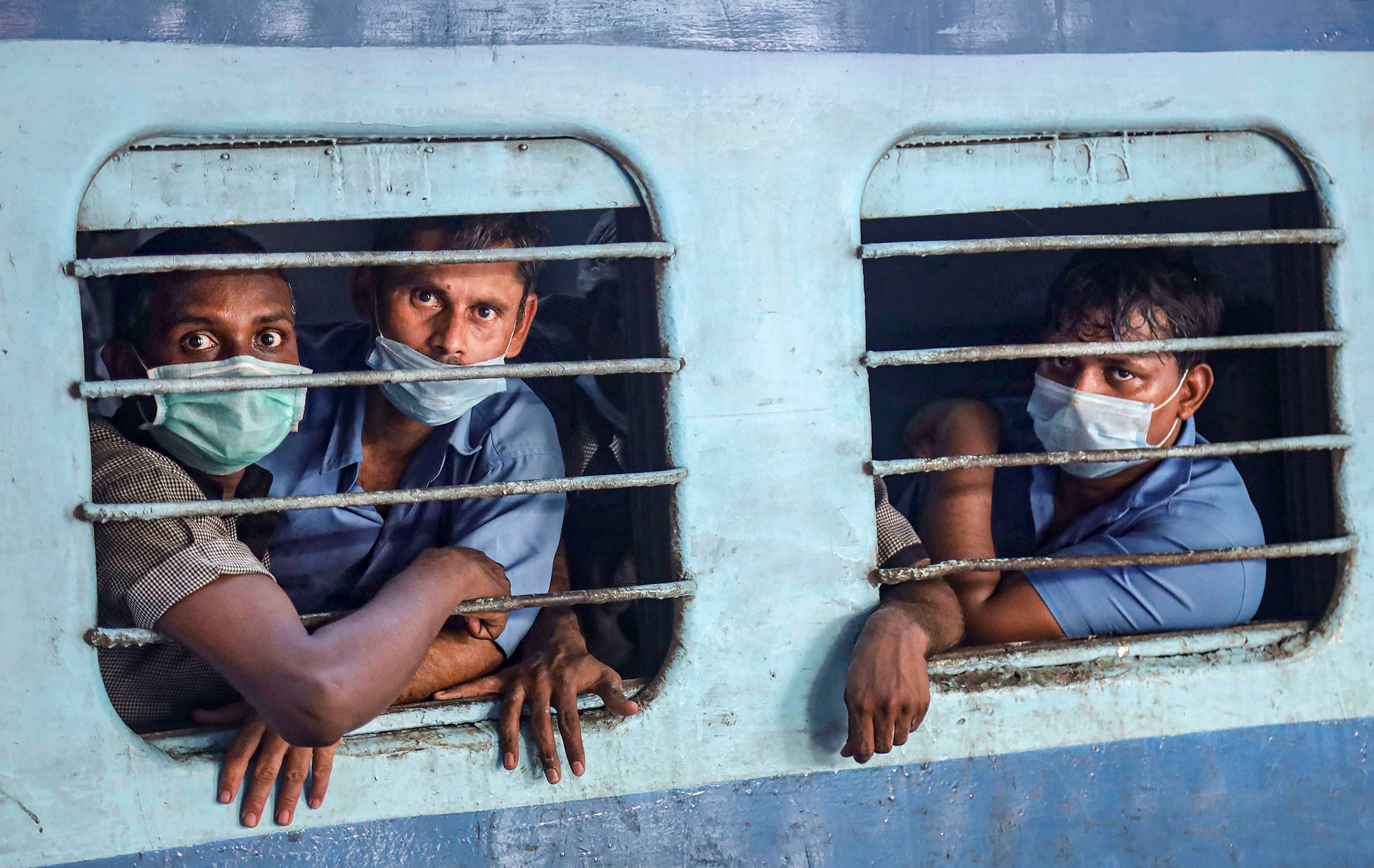 Passengers wearing masks in the wake of coronavirus (COVID-19) pandemic travel in a train, in Kozhikode. (PTI Photo)