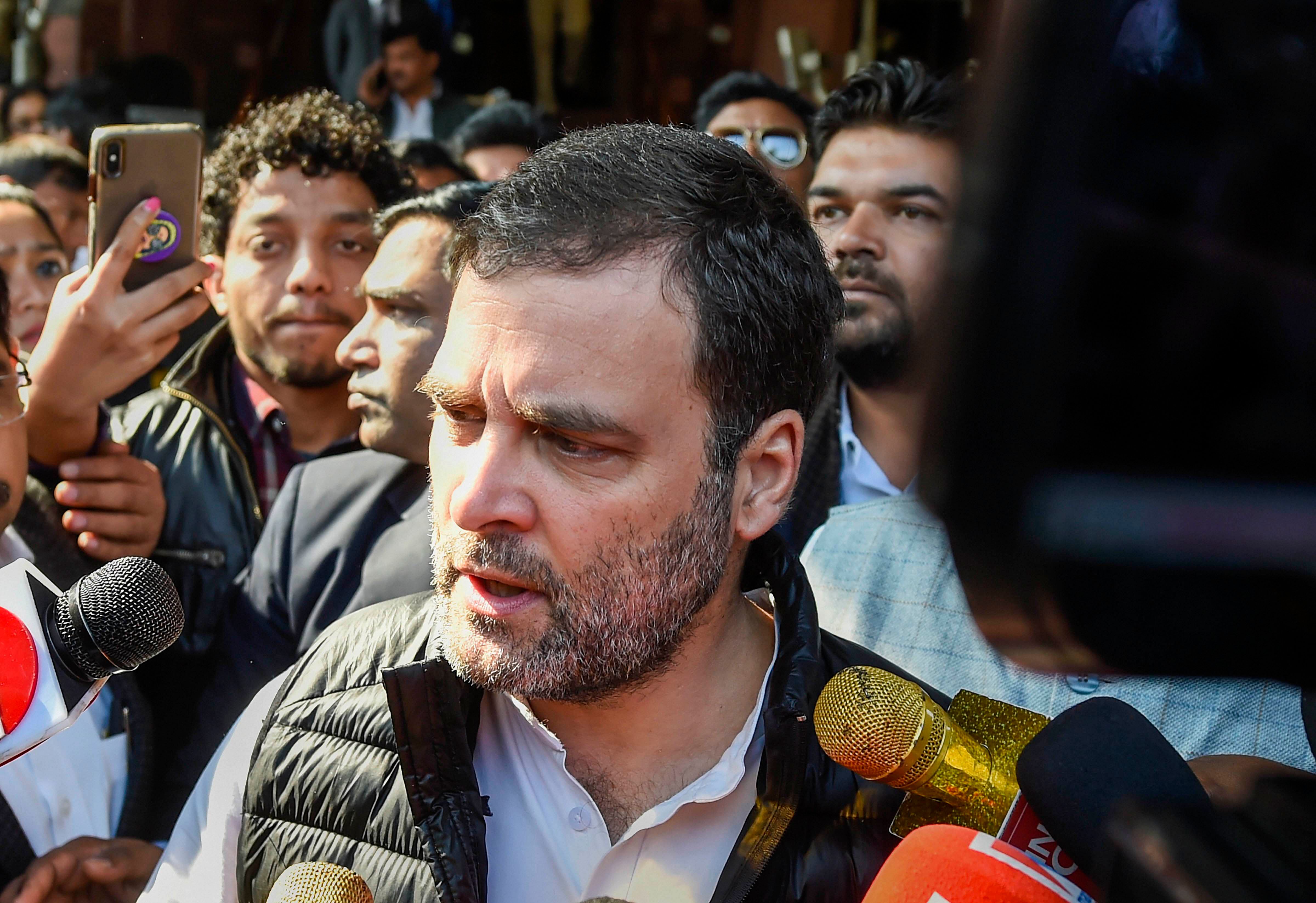 Congress leader Rahul Gandhi speaks to the media persons as he leaves the Parliament House during the ongoing Budget Session, in New Delhi. (PTI Photo)