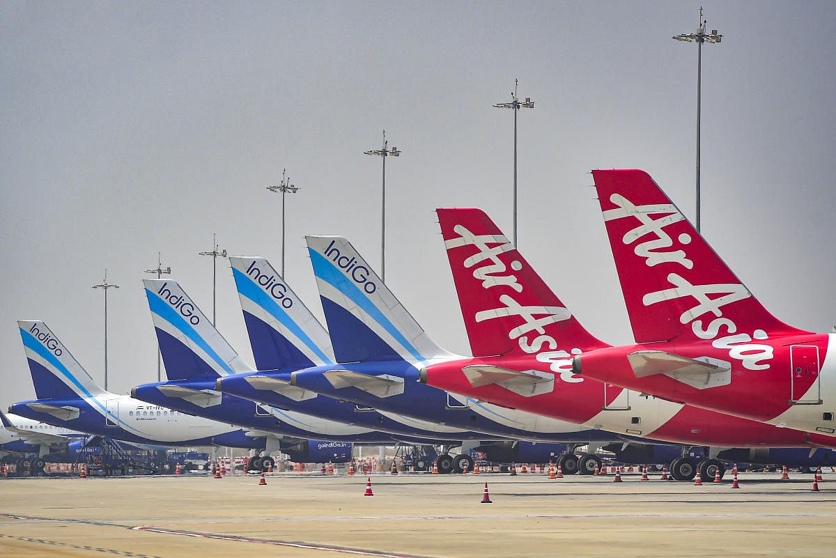 Indigo and Air Asia aircrafts parked at International Airport in Bengaluru, Tuesday, March 3, 2020. (PTI Photo)