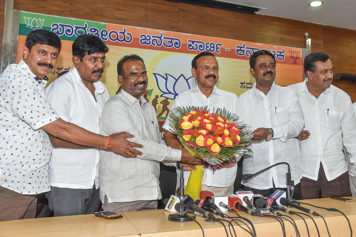 State BJP secretary Ravikumar, MLC Narayanaswamy, party leaders Harish, Muniraju and Ashwathnarayana felicitate Union Minister for Chemicals and Fertilisers D V Sadananda Gowda during his first visit to Jagannath Bhavan, the party's state headquarters, in