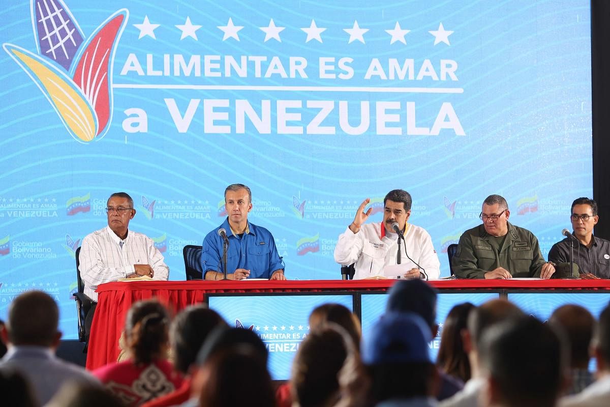 Venezuela's President Nicolas Maduro (C) speaking during a television programme in La Guaira, Venezuela. (Photo by AFP)