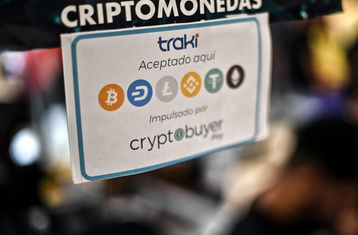 View of a sign advertising the payment with Venezuelan cryptocurrency Petro at a store in Caracas. (AFP PHOTO)