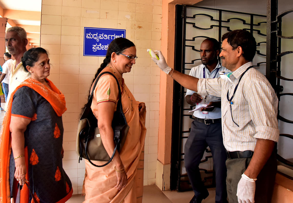 Visitors screened at the entrace of DC's office in Mangaluru.