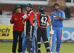 Munaf Patel gestures to England's Ravi Bopara  as play is stopped due to rain during the fourth one day cricket match between England and India at Lord's cricket ground in London, on September 11, 2011. AFP