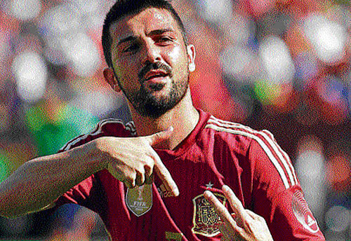 Predator: Spain's David Villa celebrates after scoring against El Salvador in a friendly on Saturday. reuters